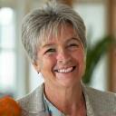 Happy client Sarah M., smiling with radiant health.
